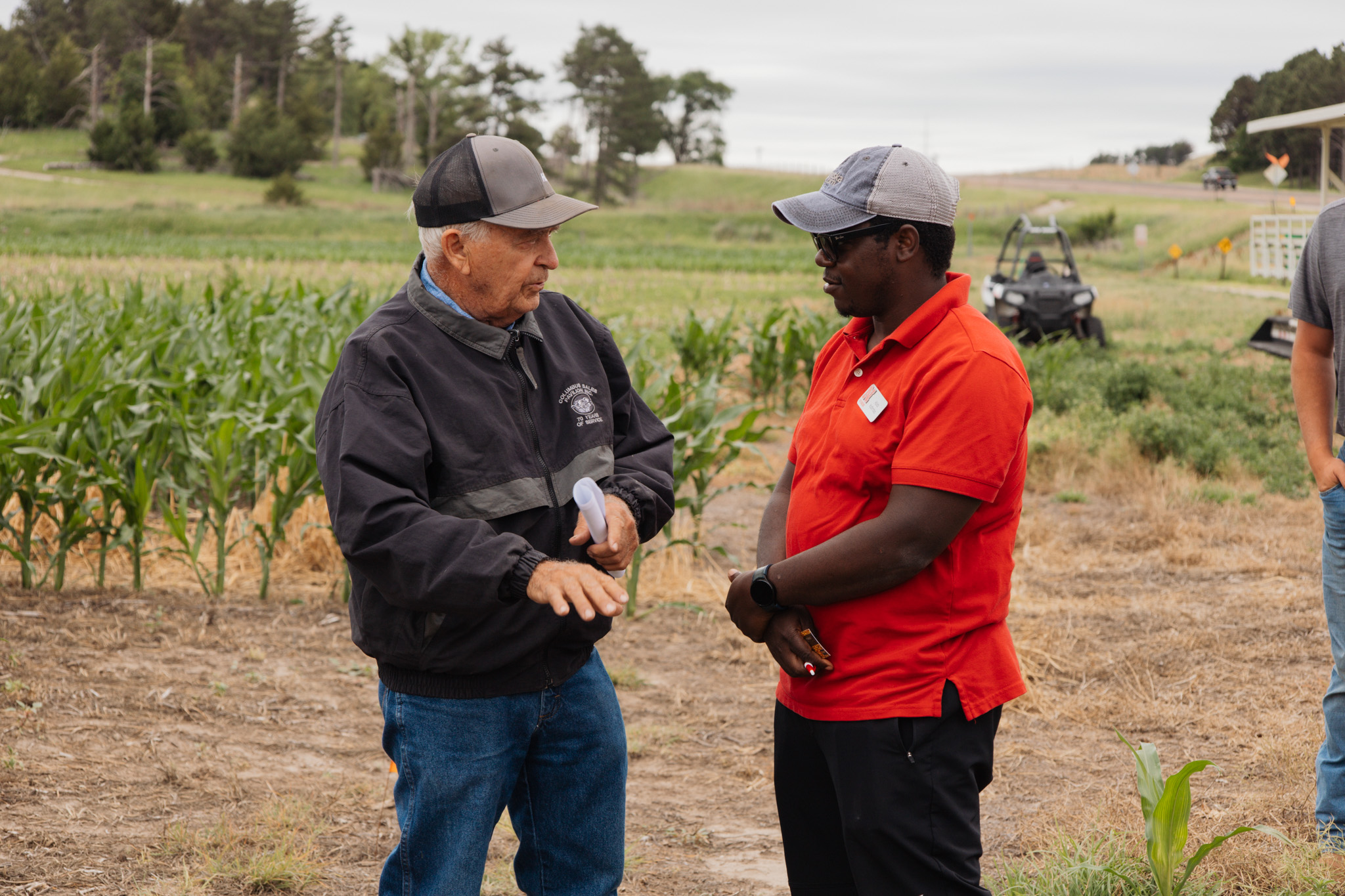 Extension specialist talking to a farmer