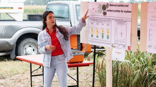 Student presents research at field day