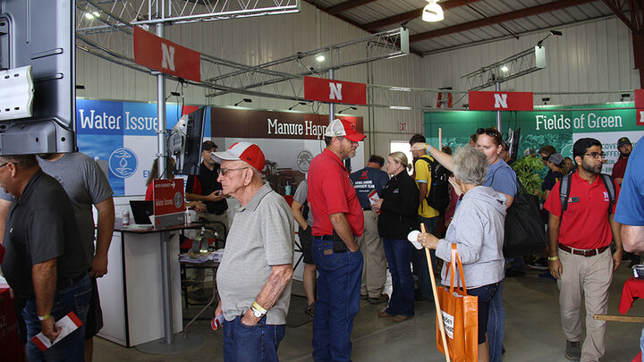 Test your crop knowledge, explore new technologies, and get answers to your toughest farm questions — Nebraska Extension is bringing a full slate of solutions to Husker Harvest Days 2025.   Nebraska Extension educators and specialists chat with attendees during the 2021 Husker Harvest Days. (CropWatch file photo)