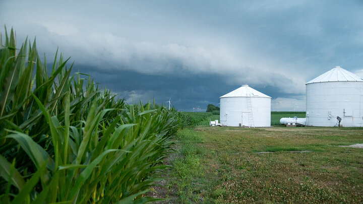 farm scene with storm clouds coming in