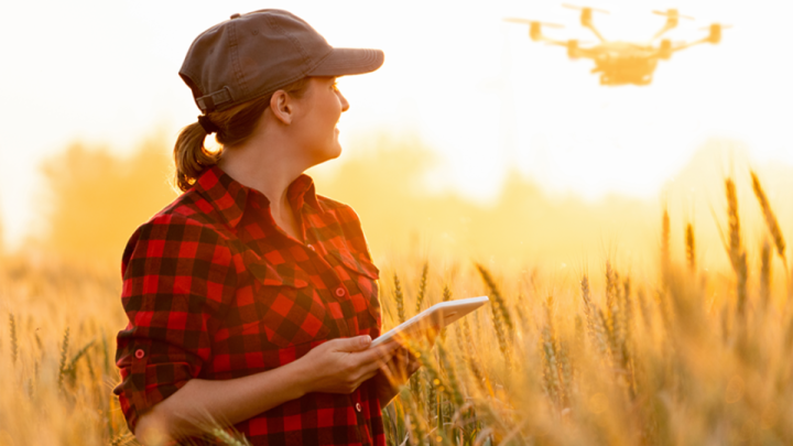 Farmer running a drone in a field